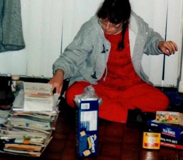 Me cleaning.  My mom just realized that I actually do look a lot like her.  I don't mind this so much--I think mom is pretty good looking, even if she is quite fluffy.  I am glad I'm not like her in saving every paper...not because she is a pack rat, just too lazy to throw it out.