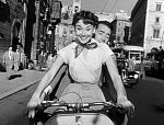 Audrey Hepburn and Gregory Peck on a vespa in Roman Holiday