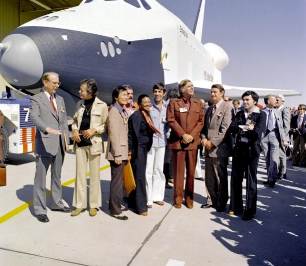 two of Sleepy's favourite old geezers wearing flared trousers with a permanent crease (DeForest Kelley, second from the left) and Leonard Nimoy (the skinny guy in the middle, to the left of Gene Roddenberry, the guy in the brown suit).