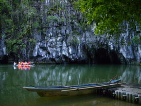 puerto princesa subterraenean river
The Puerto Princesa Subterranean River National Park is located about 50 km north of the city of Puerto Princesa, Palawan, Philippines. It features a limestone karst mountain landscape with an 8.2 km. navigable underground river. A distinguishing feature of the river is that it winds through a cave before flowing directly into the South China Sea. It includes major formations of stalactites and stalagmites, and several large chambers. The lower portion of the river is subject to tidal influences. The underground river is reputed to be the world's longest. At the mouth of the cave, a clear lagoon is framed by ancient trees growing right to the water's edge. Monkeys, large monitor lizards, and squirrels find their niche on the beach near the cave.