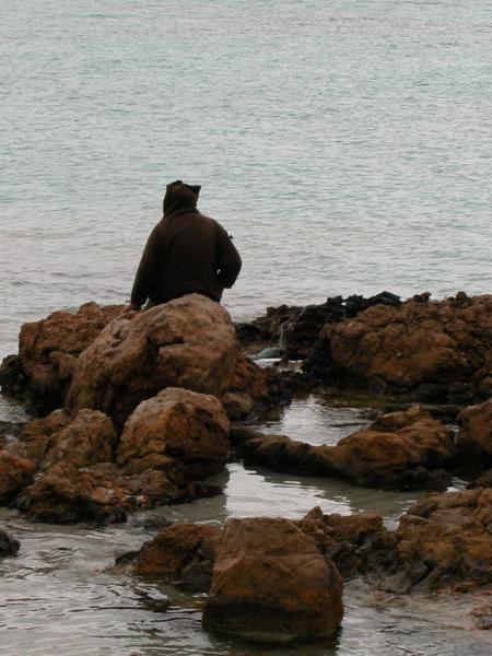 mysterious figure on the beach