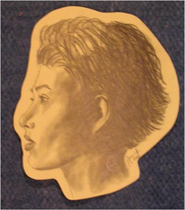 Female from the cover of the book called "The Fundamentals of Drawing Portraits"