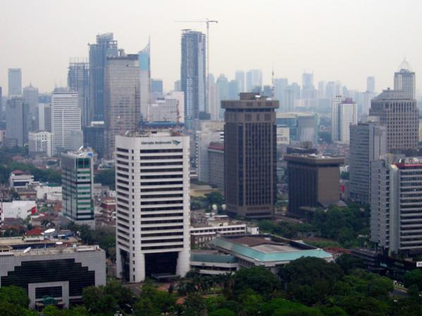 Some thirty hours by connecting flights from Washington DC,
Jakarta is a splatter of skyscrapers and malls, slums and festering canals.