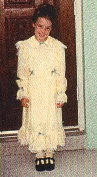 Me, Easter of 1983.  My aunt had made the dress, buying a pattern that was too large for me because she was making dresses for older girls too. She didn't finish it, so it had pins keeping the hems up.  She did my hair, taking hours and hitting me in the head when I fidgeted.  I looked pretty, but that was when I decided not to be a fashion model.  I told her, when she wanted to doll me up in the future, "I'm not a banana curl girl."