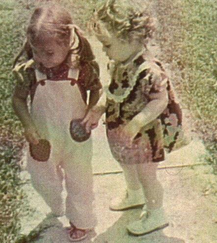 Me and my cousin Jennifer outside of my grandparent's house.  We look pretty companionable there, but I don't remember liking her.