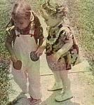 Me and my cousin Jennifer outside of my grandparent's house.  We look pretty companionable there, but I don't remember liking her.