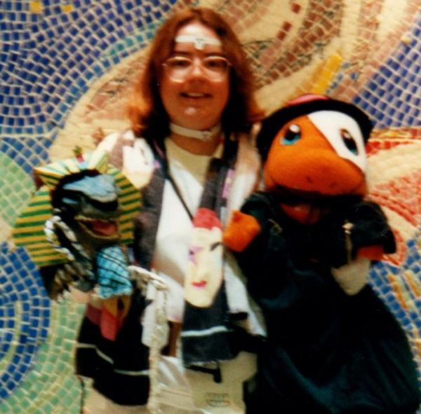 During my eccentric period, I carried around a Godzilla puppet named Vince and a big orange Charmander Pokemon named Jared.  I dressed them up.  This was taken on Halloween.  Vince was a pharoah, Jared the Phantom of the Opera.  I was Mystique from X-men, but I couldn't paint myself blue because I was allergic to the paint.