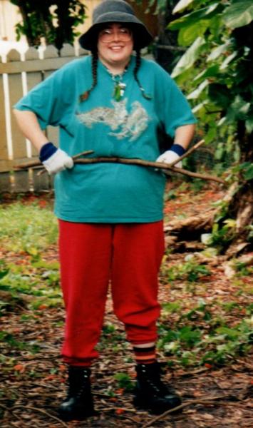 Me after Hurricane Wilma cleaning up.  Wilma struck on my mom's birthday.  It took out the two new things in our house--the AC and the TV. I was lucky--I had been thinking of getting something to eat in the area where the AC came through.  We were without electric for three weeks.  We could barely get out our front door because the trees had fallen debris shoulder heighth.  Our large tree had fallen and went through our neighbor's house.
