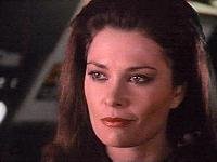 Diana (Jane Badler) smirking as she flees in the last scene of The Final Battle or the beginning scene of the pilot TV series, which started with Diana's escape.