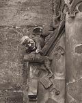 Devil nabs a wayward school boy. Carving on community well at Saint Lorenz church in Nuremberg Germany. 
Photo from 1988 Pentax ME Super. Digital...
